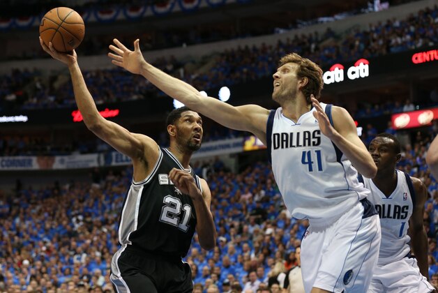 Apr 28, 2014; Dallas, TX, USA; San Antonio Spurs forward Tim Duncan (21) shoots against Dallas Mavericks forward Dirk Nowitzki (41) during the first half in game four of the first round of the 2014 NBA Playoffs at American Airlines Center. Mandatory Credit: Matthew Emmons-USA TODAY Sports Apr 28, 2014; Dallas, TX, USA; San Antonio Spurs forward Tim Duncan (21) shoots against Dallas Mavericks forward Dirk Nowitzki (41) during the first half in game four of the first round of the 2014 NBA Playoffs at American Airlines Center. Mandatory Credit: Matthew Emmons-USA TODAY Sports