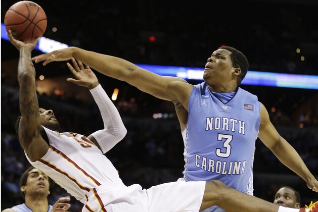 Iowa State guard DeAndre Kane (50) tries to shoot as North Carolina forward Kennedy Meeks (3) defends during the second half of a third-round game in the NCAA college basketball tournament Sunday, March 23, 2014, in San Antonio. (AP Photo/David J. Phillip)
