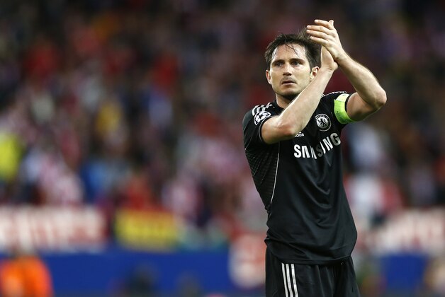 Chelsea's Frank Lampard greets Chelsea fans after the Champions League semifinal first leg soccer match between Atletico Madrid and Chelsea at the Vicente Calderon stadium in Madrid, Spain, Tuesday, April 22, 2014. The match ended in a 0-0 draw. (AP Photo/Andres Kudacki)