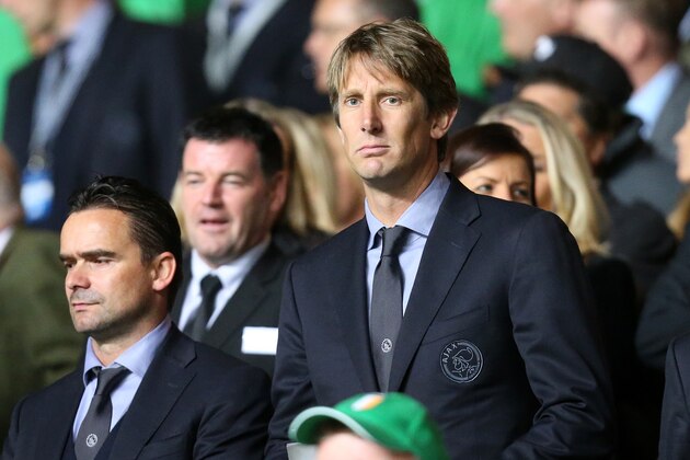 Edwin Van Der Sar, center, former Ajax and Manchester United goalkeeper looks on from the stands ahead of the Champions League Group H soccer match between Celtic and Ajax at Celtic Park, Glasgow, Scotland, Tuesday Oct. 22, 2013. (AP Photo/Scott Heppell)