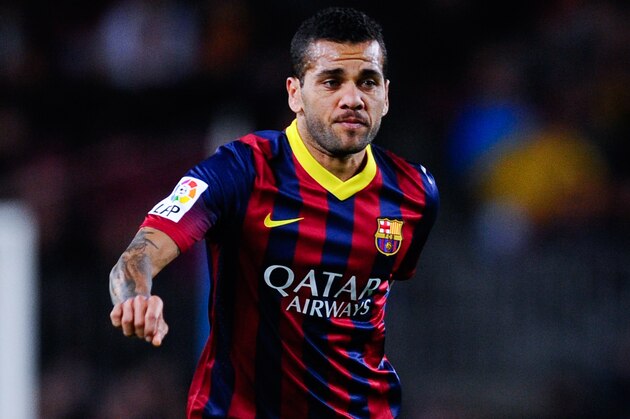BARCELONA, SPAIN - JANUARY 26:  Dani Alves of FC Barcelona runs with the ball during the La Liga match between FC Barcelona and Malaga CF at Camp Nou on January 26, 2014 in Barcelona, Spain.  (Photo by David Ramos/Getty Images)