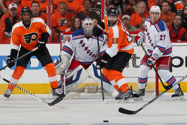 PHILADELPHIA, PA - APRIL 22: Wayne Simmonds #17 and Scott Hartnell #19 of the Philadelphia Flyers attempt a scoring chance in front of goaltender Henrik Lundqvist #30 and Ryan McDonagh #27 of the New York Rangers in Game Three of the First Round of the 2014 Stanley Cup Playoffs at the Wells Fargo Center on April 22, 2014 in Philadelphia, Pennsylvania. The Rangers went on to defeat the Flyers 4-1. (Photo by Len Redkoles/NHLI via Getty Images)