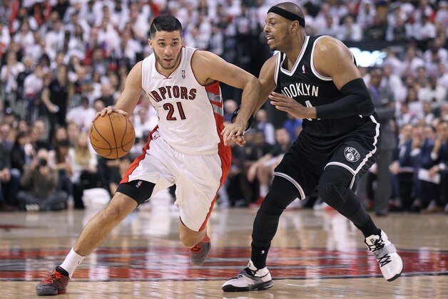 TORONTO, ON - APRIL 19:  Greivis Vasquez #21 of the Toronto Raptors breaks around Paul Pierce #34 of the Brooklyn Nets in Game One of the NBA Eastern Conference play-off at the Air Canada Centre on April 19, 2014 in Toronto, Ontario, Canada. The Nets defeated the Raptors 94-87 to take a 1-0 series lead. NOTE TO USER: user expressly acknowledges and agrees that, by downloading and/or using this Photograph, user is consenting to the terms and conditions of the Getty Images License Agreement. (Photo by Claus Andersen/Getty Images)