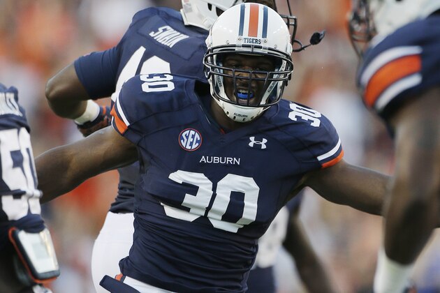 Auburn defensive end Dee Ford (30) celebrates in the first half of an NCAA college football game against Mississippi State in Auburn, Ala., Saturday, Sept. 14, 2013. (AP Photo/Dave Martin)