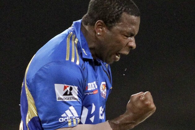 Mumbai Indians' Kieron Pollard celebrates after dismissing Kolkata Knight Riders' Manoj Tiwary during an Indian Premier League (IPL) cricket match in Kolkata, India, Saturday, May 12, 2012. (AP Photo/Bikas Das)