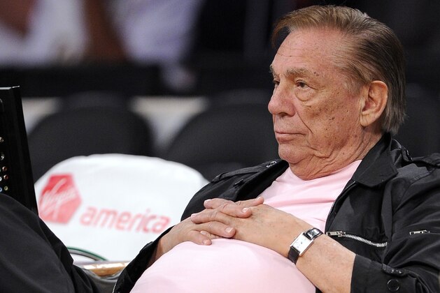 FILE - In this Oct. 17, 2010 file photo, Los Angeles Clippers team owner Donald Sterling watches his team play in Los Angeles. A jury has returned a $17.3 million verdict against Sterling in a lawsuit by an actress who lost most of her belongings in a fire at a West Hollywood apartment building he owns. City News Service says the jury awarded $15 million in punitive damages to Robyn Cohen on Tuesday, Dec. 17, 2012, in her breach-of-contract and emotional distress lawsuit. (AP Photo/Mark J. Terrill, File)