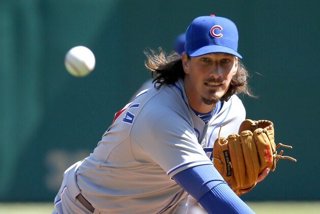 Chicago Cubs starting pitcher Jeff Samardzija throws a warmup pitch between innings during their opening day baseball game against the Pittsburgh Pirates on Monday, March 31, 2014, in Pittsburgh. (AP Photo/Gene Puskar)