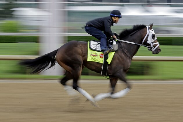 Exercise rider Joel Barrientos takes Kentucky Derby hopeful General a Rod for a morning workout at Churchill Downs Tuesday, April 29, 2014, in Louisville, Ky. (AP Photo/Morry Gash)