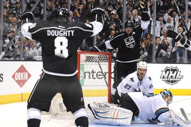 LOS ANGELES, CA - APRIL 28:  Anze Kopitar #11 of the Los Angeles Kings and Drew Doughty #8 celebrate a goal for a 4-1 lead in front of Alex Stalock #32 and Scott Hannan #27 of the San Jose Sharks during the third period in Game Six of the First Round of the 2014 NHL Stanley Cup Playoffs at Staples Center on April 28, 2014 in Los Angeles, California.  (Photo by Harry How/Getty Images)