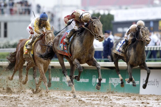 May 4, 2013; Louisville, KY, USA; Joel Rosario aboard Orb (16) defeats Calvin Borel aboard Revolutionary (3) and Robby Albarado aboard Golden Soul (4) to win the 2013 Kentucky Derby at Churchill Downs. Mandatory Credit: Mark Zerof-USA TODAY Sports