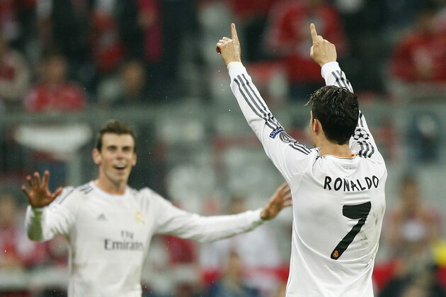 Real's Cristiano Ronaldo celebrates scoring his side's 4th goal during the Champions League semifinal second leg soccer match between Bayern Munich and Real Madrid at the Allianz Arena in Munich, southern Germany, Tuesday, April 29, 2014. (AP Photo/Matthias Schrader) Real's Cristiano Ronaldo celebrates scoring his side's 4th goal during the Champions League semifinal second leg soccer match between Bayern Munich and Real Madrid at the Allianz Arena in Munich, southern Germany, Tuesday, April 29, 2014. (AP Photo/Matthias Schrader)