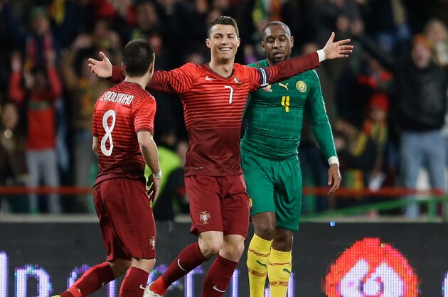 Portugal's Cristiano Ronaldo celebrates after scoring his second goal during their friendly soccer match with Cameroon Wednesday, March 5 2014, in Leiria, Portugal. The game is part of both teams' preparation for the World Cup in Brazil. (AP Photo/Armando Franca)