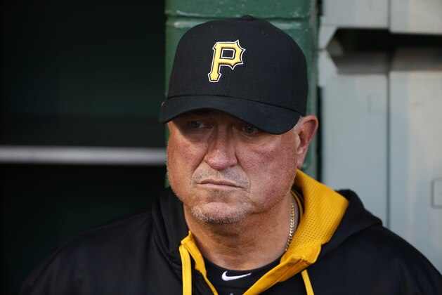 Pittsburgh Pirates manager Clint Hurdle stands in the dugout before a baseball game between the Pittsburgh Pirates and the Milwaukee Brewers in Pittsburgh Thursday, April 17, 2014. The Pirates won 11-2. (AP Photo/Gene J. Puskar)