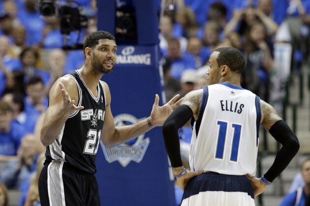 San Antonio Spurs' Tim Duncan gestures toward an official after being charged with a foul as Dallas Mavericks' Monta Ellis watches in Game 4 of an NBA basketball first-round playoff series, Monday, April 28, 2014, in Dallas. The Spurs won 93-89. (AP Photo/Tony Gutierrez)