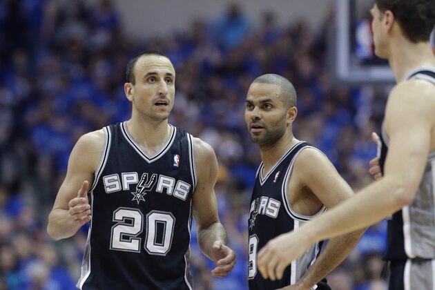 San Antonio Spurs guard Manu Ginobili (20) looks to the bench with teammates guard Tony Parker (9) during the second half of Game 3 of an NBA basketball first-round playoff series Dallas Mavericks in Dallas, Saturday, April 26, 2014. (AP Photo/LM Otero)