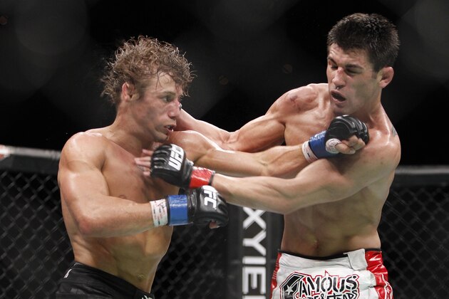 Urijah Faber, left, trades punches with Dominick Cruz during the first round of their UFC bantamweight mixed martial arts title match, Saturday, July 2, 2011 at The MGM Grand Garden Arena in Las Vegas. Cruz won by unanimous decision. (AP Photo/Eric Jamison) Urijah Faber, left, trades punches with Dominick Cruz during the first round of their UFC bantamweight mixed martial arts title match, Saturday, July 2, 2011 at The MGM Grand Garden Arena in Las Vegas. Cruz won by unanimous decision. (AP Photo/Eric Jamison)