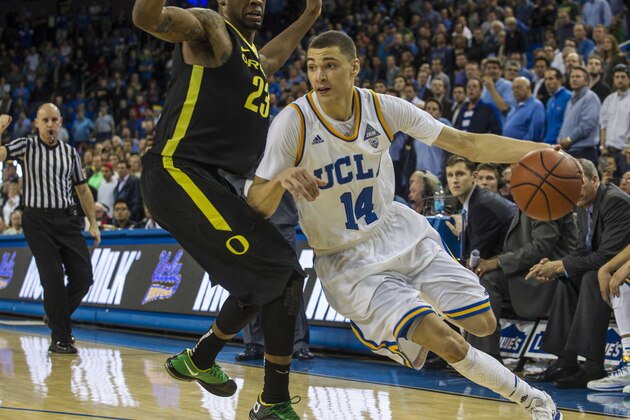 UCLA guard Zach LaVine #14 and Oregon forward Elgin Cook #23 in the NCAA college basketball game Thursday, Feb. 27, 2014, in Los Angeles. (AP Photo/Ringo H.W. Chiu)