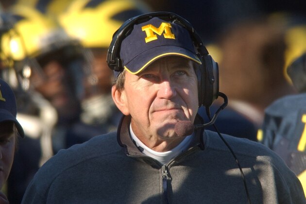 ** FILE ** Michigan football coach Lloyd Carr looks towards the scoreboard during the game against Northwestern at Michigan Stadium in Ann Arbor, Mich., Saturday, Nov. 13, 2004. Michigan won another Big Ten title and a trip to the Rose Bowl, but its 2004 season might well be remembered for losses in its last two games.  (AP Photo/Carlos Osorio, file)