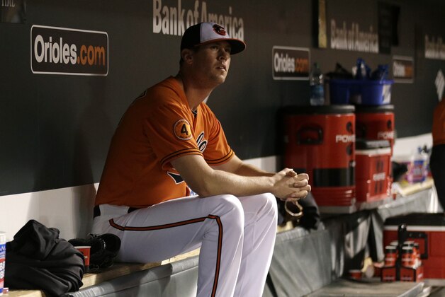 Baltimore Orioles relief pitcher Brian Matusz sits in the dugout after he was pulled from the game during a baseball game against the Boston Red Sox, Saturday, Sept. 28, 2013, in Baltimore. (AP Photo/Patrick Semansky)