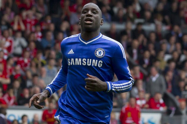 Chelsea's Demba Ba celebrates scoring against Liverpool during their English Premier League soccer match at Anfield Stadium, Liverpool, England, Sunday April 27, 2014. (AP Photo/Jon Super)
