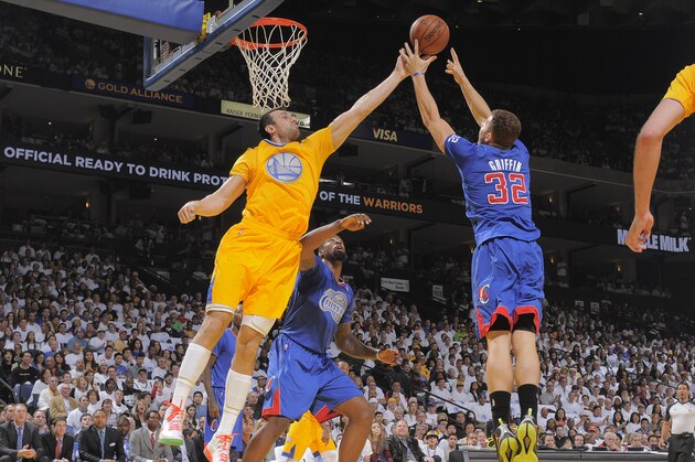 OAKLAND, CA - DECEMBER 25: Andrew Bogut #12 of the Golden State Warriors rebounds against Blake Griffin #32 of the Los Angeles Clippers on December 25, 2013 at Oracle Arena in Oakland, California. NOTE TO USER: User expressly acknowledges and agrees that, by downloading and or using this photograph, user is consenting to the terms and conditions of Getty Images License Agreement. Mandatory Copyright Notice: Copyright 2013 NBAE (Photo by Rocky Widner/NBAE via Getty Images)