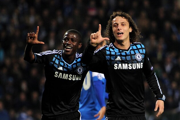 GENK, BELGIUM - NOVEMBER 01:  Ramires of Chelsea celebrates scoring the opening goal with team mate David Luiz (R) during the UEFA Champions League Group E match between KRC Genk and Chelsea at the KRC Genk Arena on November 1, 2011 in Genk, Belgium.  (Photo by Jamie McDonald/Getty Images)