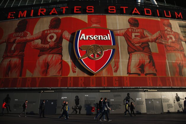 LONDON, ENGLAND - APRIL 15: Fans walk past the ground prior to the Barclays Premier League match between Arsenal and West Ham United at Emirates Stadium on April 15, 2014 in London, England. (Photo by Paul Gilham/Getty Images) LONDON, ENGLAND - APRIL 15: Fans walk past the ground prior to the Barclays Premier League match between Arsenal and West Ham United at Emirates Stadium on April 15, 2014 in London, England. (Photo by Paul Gilham/Getty Images)