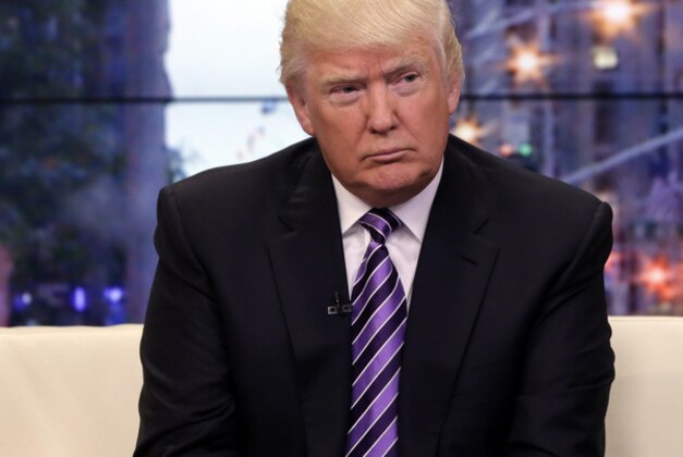 This Sept. 16, 2013 photo, Donald Trump appears on the