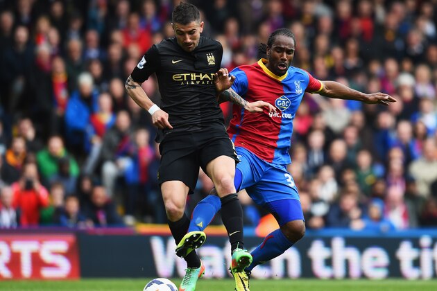 LONDON, ENGLAND - APRIL 27:  Cameron Jerome of Crystal Palace challenges for the ball with Aleksandar Kolarov of Manchester City during the Barclays Premier League match between Crystal Palace and Manchester City at Selhurst Park on April 27, 2014 in London, England.  (Photo by Mike Hewitt/Getty Images)