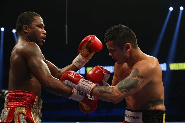 SAN ANTONIO, TX - DECEMBER 14:  (L-R) Adrien Broner and Marcos Maidana during their WBA Welterweight Title bout at Alamodome on December14, 2013 in San Antonio, Texas..  (Photo by Ronald Martinez/Getty Images)