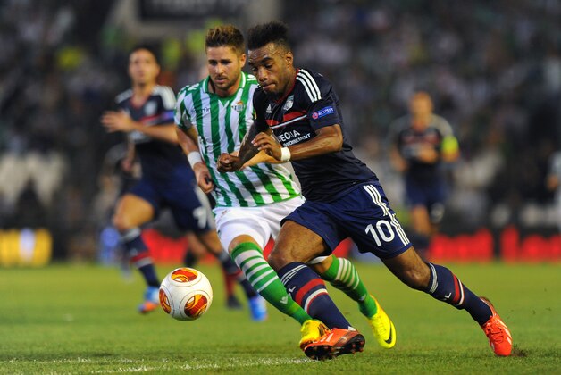 SEVILLE, SPAIN - SEPTEMBER 19:  Alexandre Lacazette (R) of Olympique Lyonnais and Markus Steinhofer of Real Betis Balompie in action during the UEFA Europa League group stage match between Real Betis Balompie and Olympique Lyonnais held on September 19, 2013 at the Benito Villamarin Stadium, in Seville, Spain. (Photo by Jorge Guerrero/EuroFootball/Getty Images)