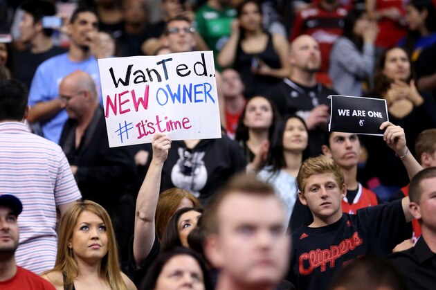 LOS ANGELES, CA - APRIL 29:  Los Angeles Clippers hold up signs referencing the Donald Sterling situation before the game with the Golden State Warriors in Game Five of the Western Conference Quarterfinals during the 2014 NBA Playoffs at Staples Center on April 29, 2014 in Los Angeles, California.   NOTE TO USER: User expressly acknowledges and agrees that, by downloading and or using this photograph, User is consenting to the terms and conditions of the Getty Images License Agreement.  (Photo by Stephen Dunn/Getty Images)