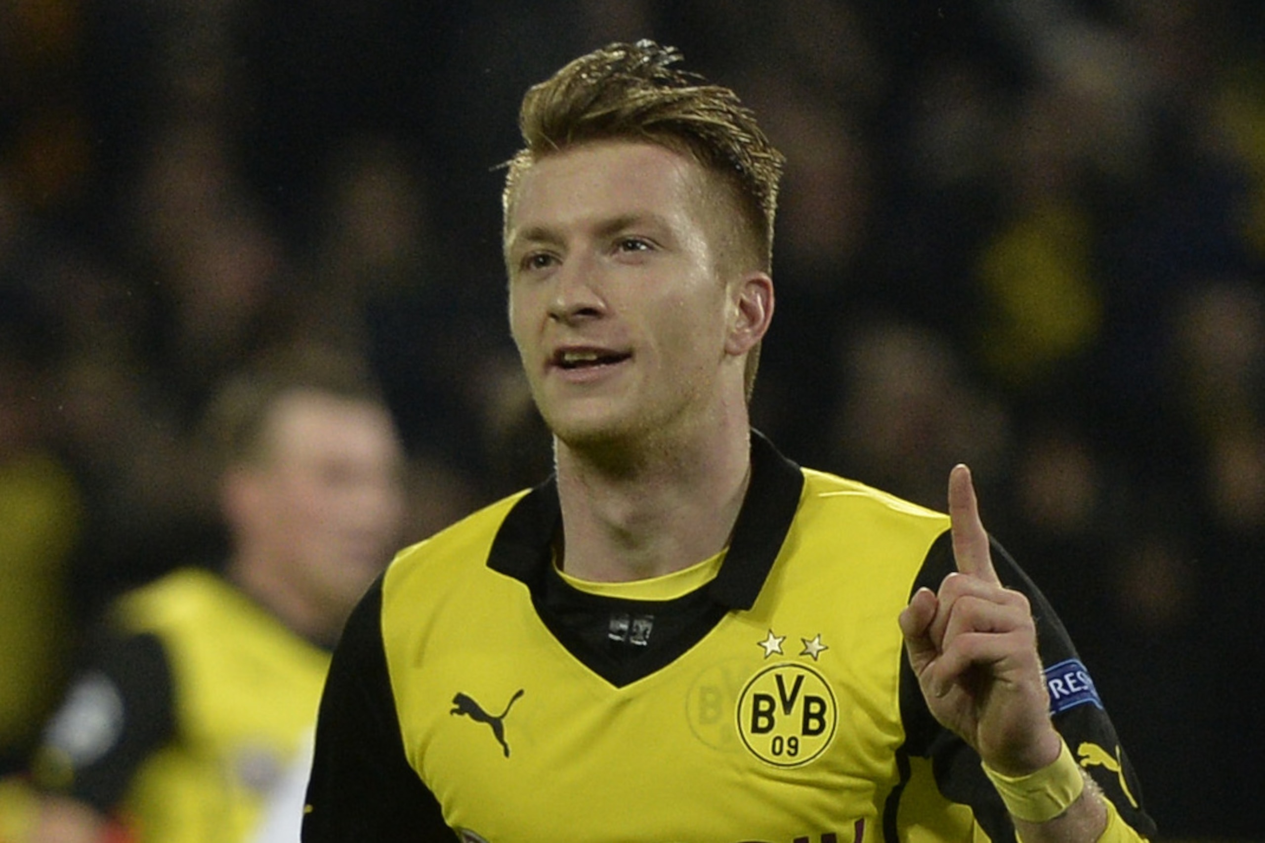 Dortmund's Marco Reus celebrates scoring his side's 2nd goal during the Champions League quarterfinal second leg soccer match between Borussia Dortmund and Real Madrid in the Signal Iduna stadium in Dortmund, Germany, Tuesday, April 8, 2014. (AP Photo/Martin Meissner)