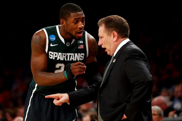 NEW YORK, NY - MARCH 28:  Head coach Tom Izzo of the Michigan State Spartans talks with Branden Dawson #22 against the Virginia Cavaliers during the regional semifinal of the 2014 NCAA Men's Basketball Tournament at Madison Square Garden on March 28, 2014 in New York City.  (Photo by Elsa/Getty Images)