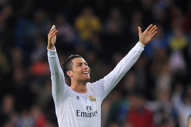 MADRID, SPAIN - APRIL 26:  Cristiano Ronaldo of Real Madrid CF celebrates after scoring Real's 2nd goal from a free kick during the La Liga match between Real Madrid CF and CA Osasuna at the Santiago Bernabeu stadium on April 26, 2014 in Madrid, Spain.  (Photo by Denis Doyle/Getty Images)