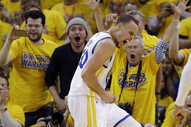 Golden State Warriors' Stephen Curry, center, celebrates after blocking a shot during the second half in Game 4 of an opening-round NBA basketball playoff series against the Los Angeles Clippers on Sunday, April 27, 2014, in Oakland, Calif. Golden State won 118-97. (AP Photo/Marcio Jose Sanchez)