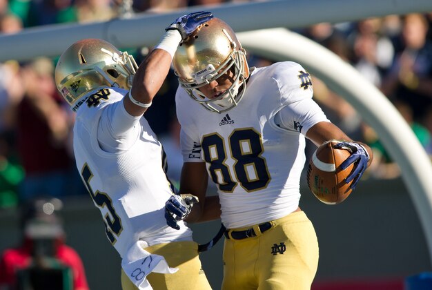 Oct 26, 2013; Colorado Springs, CO, USA; Notre Dame Fighting Irish wide receiver Corey Robinson (88) celebrates with wide receiver William Fuller (15) after scoring a touchdown in the first quarter against the Air Force Falcons at Falcon Stadium. Mandatory Credit: Matt Cashore-USA TODAY Sports
