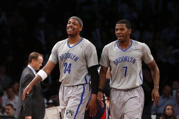 Brooklyn Nets' Paul Pierce (34) and Joe Johnson (7) react during the second half of an NBA basketball game against the Atlanta Hawks Friday, April 11, 2014, in New York.  Atlanta won 93-88. (AP Photo/Jason DeCrow)