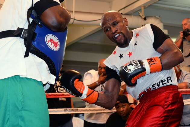LAS VEGAS, NV - APRIL 22:  Boxer Floyd Mayweather Jr. works out with his co-trainer Nate Jones at the Mayweather Boxing Club on April 22, 2014 in Las Vegas, Nevada. Mayweather will face Marcos Maidana in a 12-round world championship unification bout in Las Vegas on May 3.  (Photo by Ethan Miller/Getty Images)