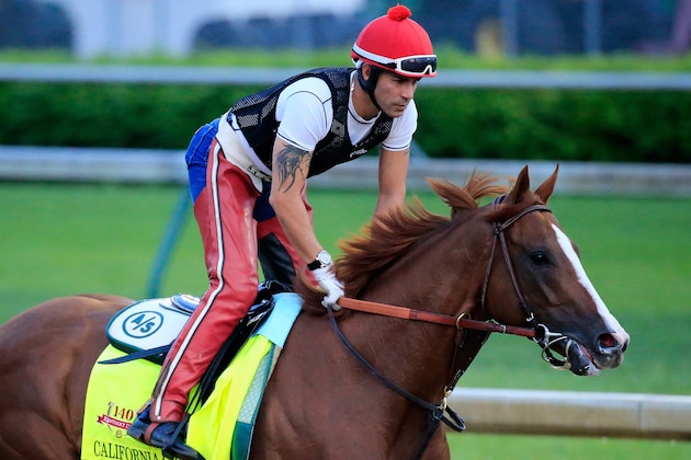 LOUISVILLE, KY - APRIL 30:  California Chrome ridden by William Delgado trains on the track during the morning exercise session in preparation for the 140th Kentucky Derby at Churchill Downs on April 30, 2014 in Louisville, Kentucky.  (Photo by Rob Carr/Getty Images)