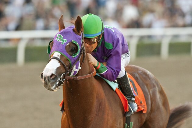 In a photo provided by Benoit Photo, California Chrome and jockey Victor Espinoza win the $250,000 California Cup Derby horse race, Saturday, Jan. 25, 2014, at Santa Anita in Arcadia, Calif. (AP Photo/Benoit Photo)