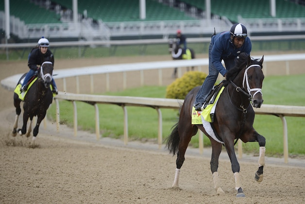Apr 30, 2014; Louisville, KY, USA; Exercise rider Nick Bush works out Kentucky Derby hopeful We Miss Artie on the track during morning workouts at Churchill Downs. Mandatory Credit: Jamie Rhodes-USA TODAY Sports