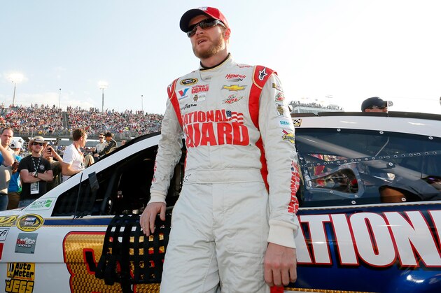 DARLINGTON, SC - APRIL 12: Dale Earnhardt Jr., driver of the #88 National Guard Chevrolet, stands on the grid prior to the NASCAR Sprint Cup Series Bojangles' Southern 500 at Darlington Raceway on April 12, 2014 in Darlington, South Carolina.  (Photo by Kevin C. Cox/Getty Images)