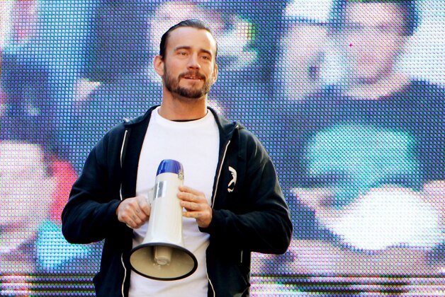 WWE superstar CM Punk addresses the crowd from the Madison Square Garden marquee, Friday, Nov. 18, 2011, in New York, during a rally leading up to the 25th Anniversary of Survivor Series, taking place Sunday at Madison Square Garden.  The event will feature actor and wrestling favorite Dwayne