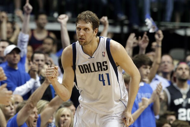 Dallas Mavericks' Dirk Nowitzki (41) of Germany celebrates sinking a three-point basket against the San Antonio Spurs in the second half of Game 4 of an NBA basketball first-round playoff series, Monday, April 28, 2014, in Dallas. The Spurs won 93-89. (AP Photo/Tony Gutierrez)