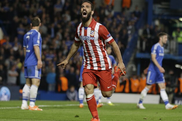 Atletico's Arda Turan celebrates after scoring his soda's 3rd goal during the Champions League semifinal second leg soccer match between Chelsea and Atletico Madrid at Stamford Bridge Stadium in London Wednesday, April 30, 2014. (AP Photo/Kirsty Wigglesworth)