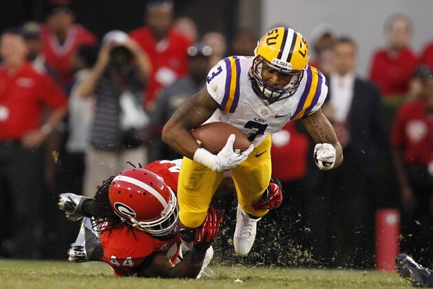LSU's Odell Beckham Jr (3) is tackled by Georgia's T.J. Stripling during the second half of an NCAA football game, Saturday, Sept. 28, 2013, in Athens, Ga. Georgia 44-41. (AP Photo/Mike Stewart)