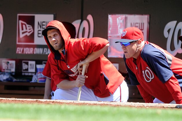 WASHINGTON, DC - APRIL 27: Bryce Harper #34 and manager Matt Williams #9 of the Washington Nationals watch the game during the second inning against the San Diego Padres at Nationals Park on April 27, 2014 in Washington, DC.  (Photo by Greg Fiume/Getty Images)