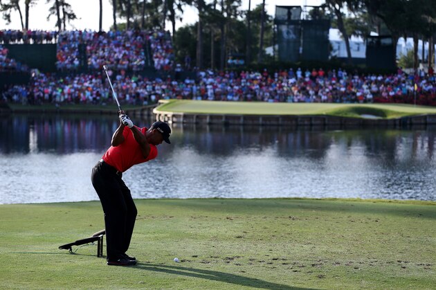 PONTE VEDRA BEACH, FL - MAY 12:  Tiger Woods of the USA plays his tee shot on the 17th hole during the final round of THE PLAYERS Championship at THE PLAYERS Stadium course at TPC Sawgrass on May 12, 2013 in Ponte Vedra Beach, Florida.  (Photo by Andy Lyons/Getty Images)