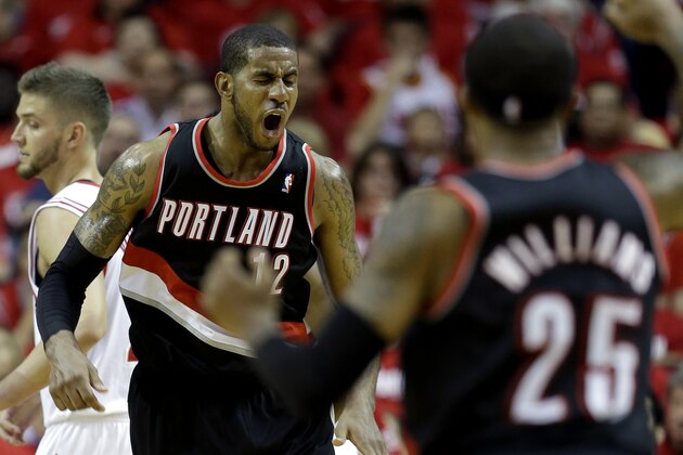 Portland Trail Blazers' LaMarcus Aldridge (12) reacts after making a basket while being fouled during the fourth quarter in Game 1 of an opening-round NBA basketball playoff series against the Houston Rockets  Sunday, April 20, 2014, in Houston. The Trail Blazers won 122-120 in overtime. (AP Photo/David J. Phillip)
